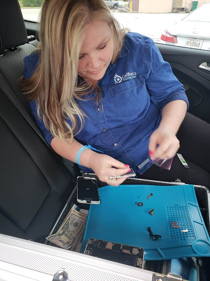 Nicole Russell Cell Phone Repair tech doing Mobile Repair from her Vehicle