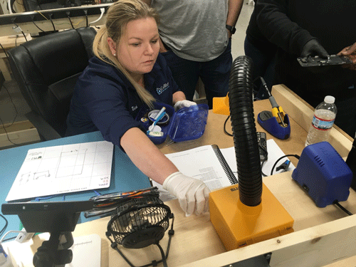 Nicole teaching soldering